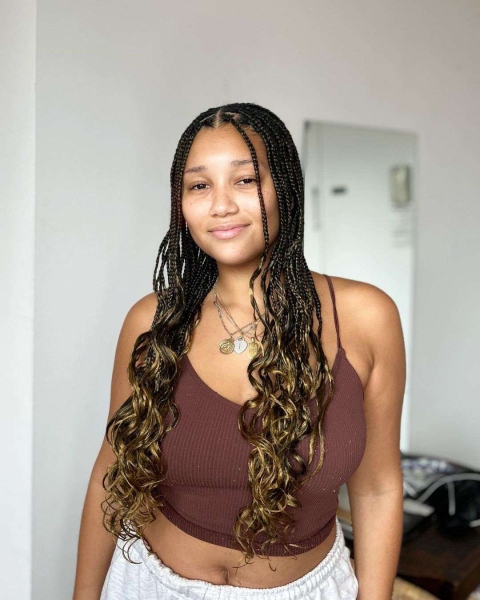 French curls are box braids done with silky, pre-curled braiding hair. Learn everything you need to know about the look, plus see 14 gorgeous French curl braids looks for inspiration.