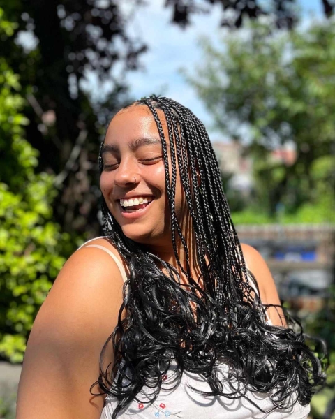 French curls are box braids done with silky, pre-curled braiding hair. Learn everything you need to know about the look, plus see 14 gorgeous French curl braids looks for inspiration.