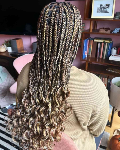 French curls are box braids done with silky, pre-curled braiding hair. Learn everything you need to know about the look, plus see 14 gorgeous French curl braids looks for inspiration.