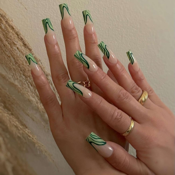 If you're looking for the best fall green nails to wear this autumn, look to these 17 photos for inspiration to take to the nail salon. From mint green to emerald hues, there's a green nail look for every occasion.