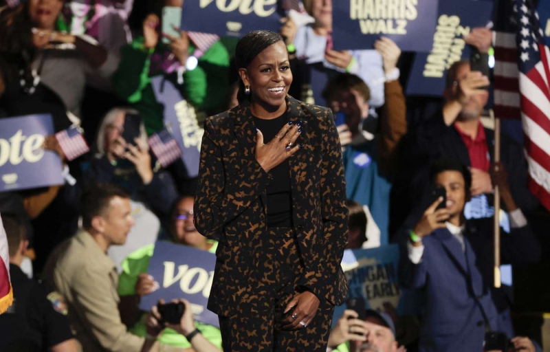 Michelle Obama wore a leopard-print pantsuit while campaigning for Kamala Harris in the swing state of Michigan on Saturday, Oct. 26. See her full look, here.