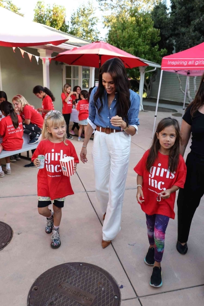 On October 2, Meghan Markle attended an appearance in a chic button-up and trouser look that could probably be found in your closet. See the look, here.