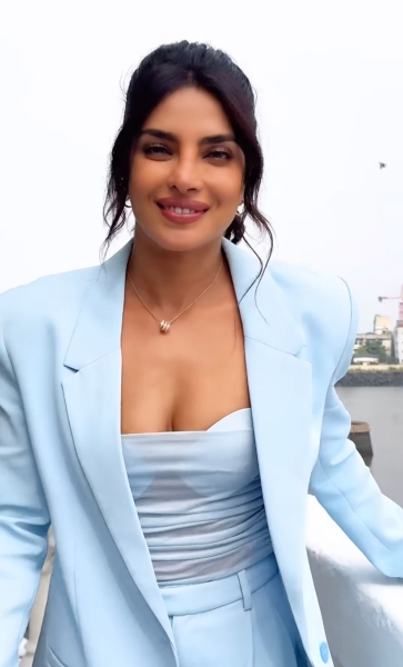 Priyanka Chopra wore a sheer spaghetti-strap top and oversized Bermuda shorts for an Instagram video in India. See her full look, here.