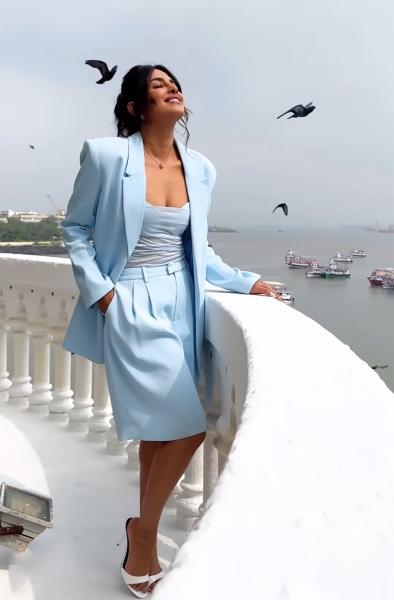 Priyanka Chopra wore a sheer spaghetti-strap top and oversized Bermuda shorts for an Instagram video in India. See her full look, here.