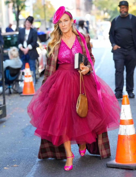 Sarah Jessica Parker was seen filming 'And Just Like That...' wearing a pink hat. See her full hot pink look, here.