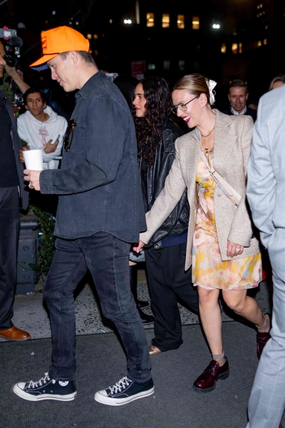 Scarlett Johansson attended the 'Saturday Night Live' afterparty with Colin Jost in a floral slip dress paired with loafers and socks. See her full outfit, here.