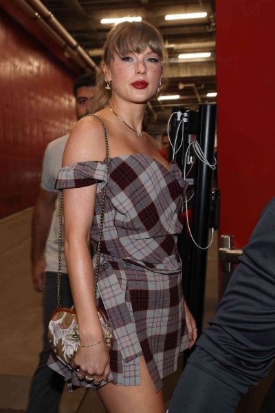 Taylor Swift arrived to the October 7, 2024, Kansas City Chiefs vs New Orleans Saints game in a plaid dress and gold freckles. See her look, here.