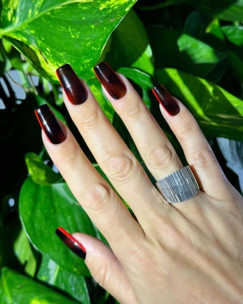 Cherry mocha is a dark and sultry shade that's inspired by deep reds and warm browns. See 15 manicures that make use of the warm hue.