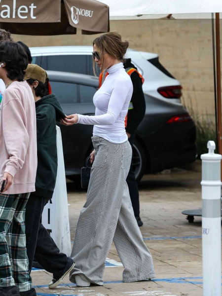 Look of the Day for November 5, 2024 features Jennifer Lopez in striped, wide-leg utility pants and Intmissimi’s best-selling, mom- and editor-approved light cashmere top while out and about in Los Angeles.