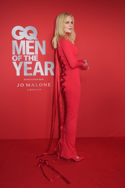 Nicole Kidman made a stunning appearance at the 'GQ' Men of the Year Awards in a slinky red gown that laced all the way up her back. See her striking look, here.