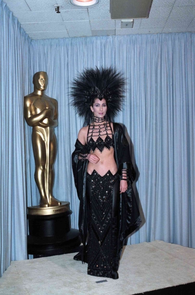 Cher explained her decision behind her wearing an ab-baring look by Bob Mackie to the 1986 Oscars in lieu of a traditional gown. See what she had to say, here.