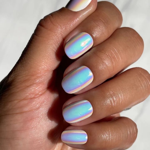 Shimmery nails will never go out of style—they just keep getting better. Simple glitter nails gave way to technicolored holographic finishes. Here's how to recreate the stunning look on your own.