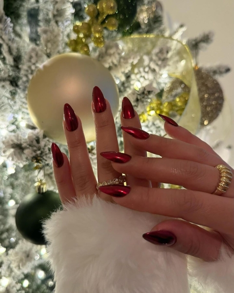 The color red is synonymous with Christmas and warm holiday cheer. Here, scroll through 18 red Christmas nail ideas for a festive touch this season.