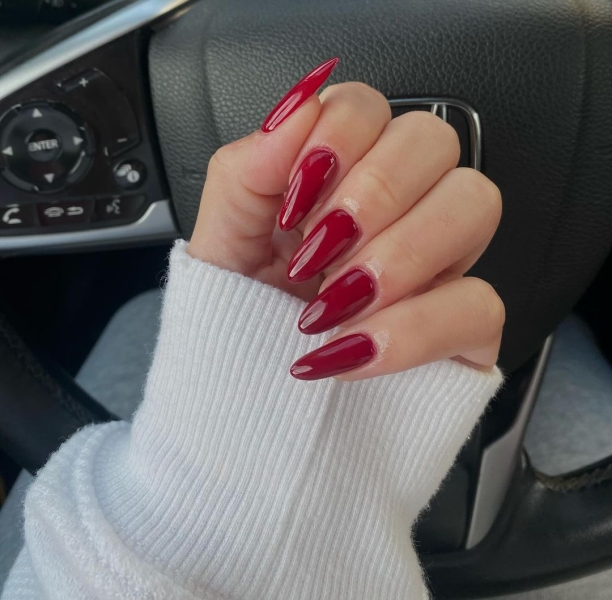 The color red is synonymous with Christmas and warm holiday cheer. Here, scroll through 18 red Christmas nail ideas for a festive touch this season.