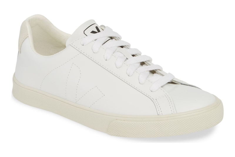 A shopping writer shares the celebrity-worn sneakers trending for spring 2025, including elevated white sneakers and sporty trainers worn by Katie Holmes, Jennifer Lawrence, and more. Shop sneakers from Adidas, Puma, Cariuma, and more starting at $70.