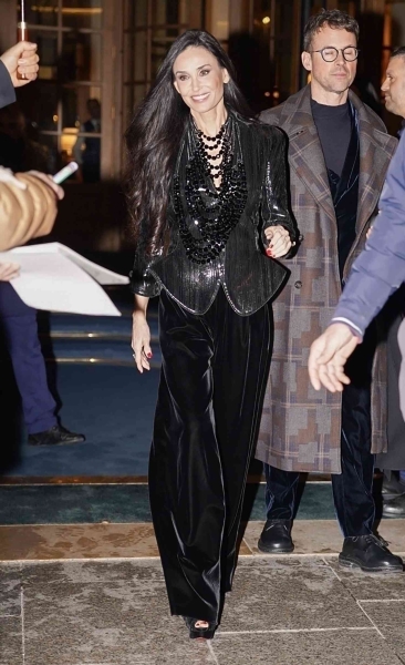 Demi Moore wore a peplum sequined blazer with ultra-exaggerated hips and shoulders to the Giorgio Armani Privé Haute Couture Spring-Summer 2025 show at Paris Couture Fashion Week on January 28. See her divisive look, here.