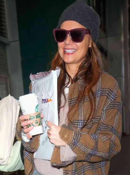 Katie Holmes wore an oversize plaid flannel jacket with baggy jeans on Jaunary 12, 2025. See her outfit here.