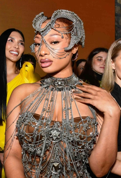 Seated front row at the Gaurav Gupta show during couture fashion week, Megan Thee Stallion sported upside-down nails. And no, that doesn't mean a reverse French manicure or a half-moon design.