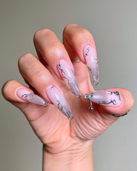 The early aughts were full of iconic beauty trends. In the nail art arena, square French manicures reigned supreme, alongside duck-shaped nails, animal prints and tattoo-inspired designs.