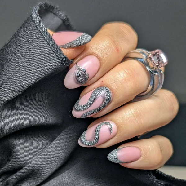 The Lunar New Year is celebrating the Year of the Snake, and we found the coolest serpent themed nail ideas that symbolize transformation and strength.