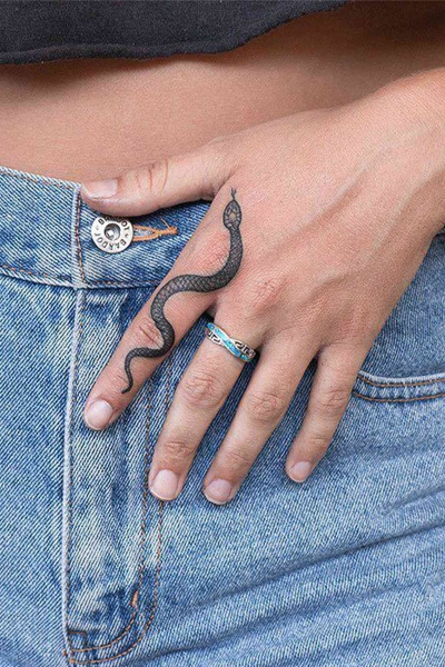 This Lunar New Year marks the Year of the Snake, and snake tattoos are coming in abundance. Here find inspiration from everything from minimalist serpent designs to bold pythons.