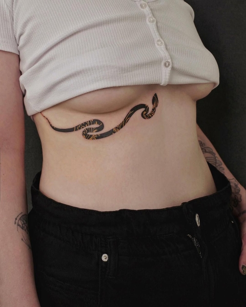 This Lunar New Year marks the Year of the Snake, and snake tattoos are coming in abundance. Here find inspiration from everything from minimalist serpent designs to bold pythons.