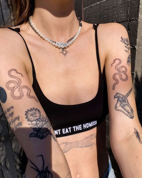 This Lunar New Year marks the Year of the Snake, and snake tattoos are coming in abundance. Here find inspiration from everything from minimalist serpent designs to bold pythons.