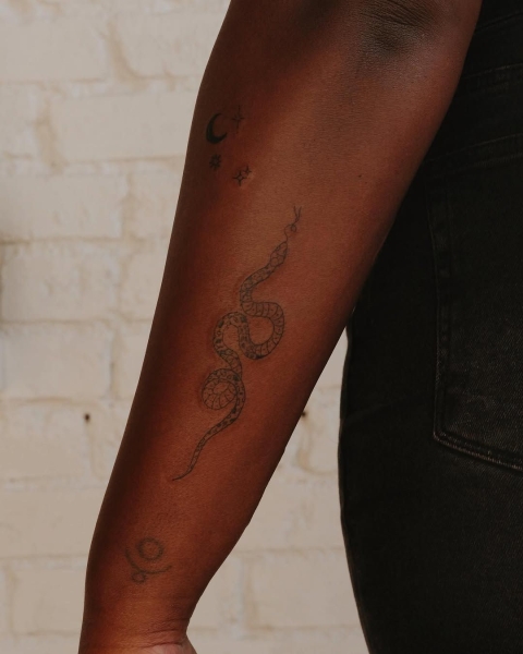 This Lunar New Year marks the Year of the Snake, and snake tattoos are coming in abundance. Here find inspiration from everything from minimalist serpent designs to bold pythons.