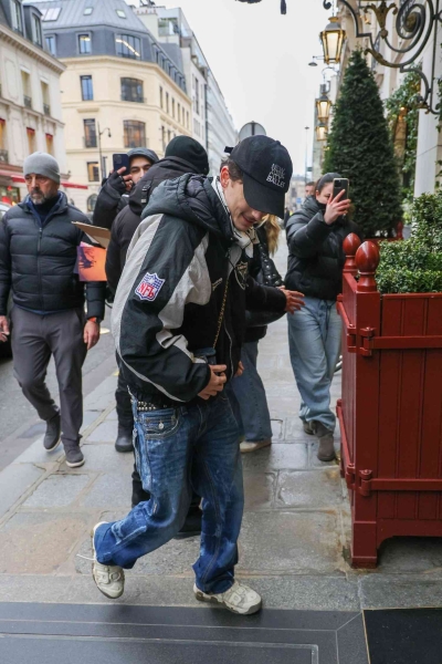 Timothée Chalamet was spotted in Paris wearing a tiny quilted denim Chanel purse that was so small, fans thought it belonged to Kylie Jenner's 6-year-old daughter, Stormi Webster. See his full look, here.