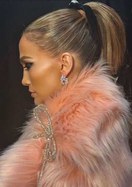 Jennifer Lopez swapped out her sheer sculptural skirt for a post-Grammys mirrored dress and bubblegum coat decorated with sparkly bows as she headed out to dinner after the Grammy Awards on February 2. See her bedazzled outfit change, here.