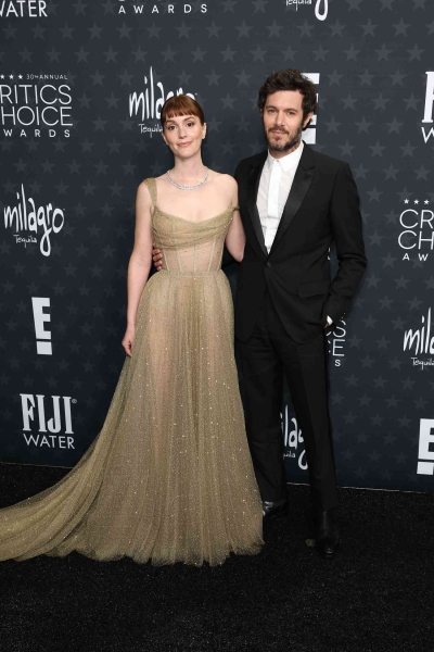 Leighton Meester wore a shimmering sheer gown for a rare date night with Adam Brody at the 2025 Critics Choice Awards. See their cute couples' appearance on the red carpet, here.