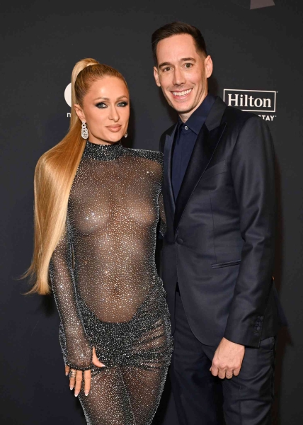 Paris Hilton wore her most naked dress yet as she went braless in a sheer LBD at Clive Davis's pre-Grammys party on Saturday, February 1. See her barely-there look, here.