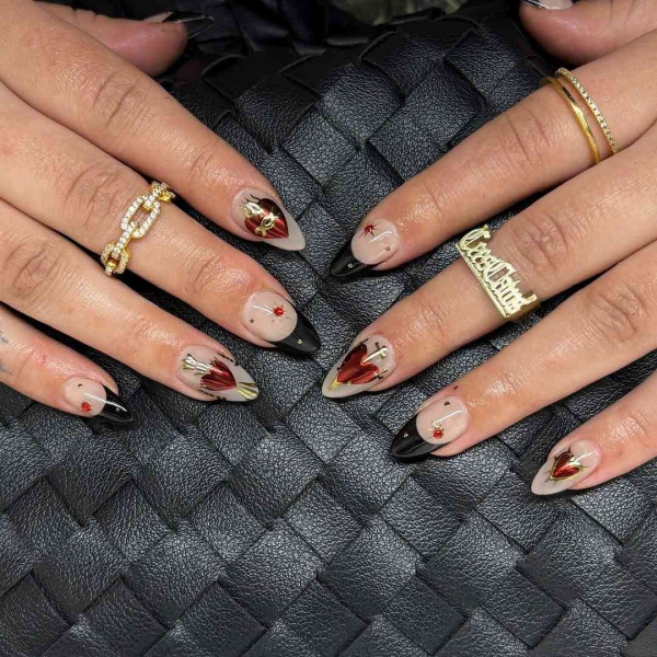 Sexy, warm, and versatile, red and black can turn any design into the perfect moody manicure. Browse 17 of our favorite combinations, here.